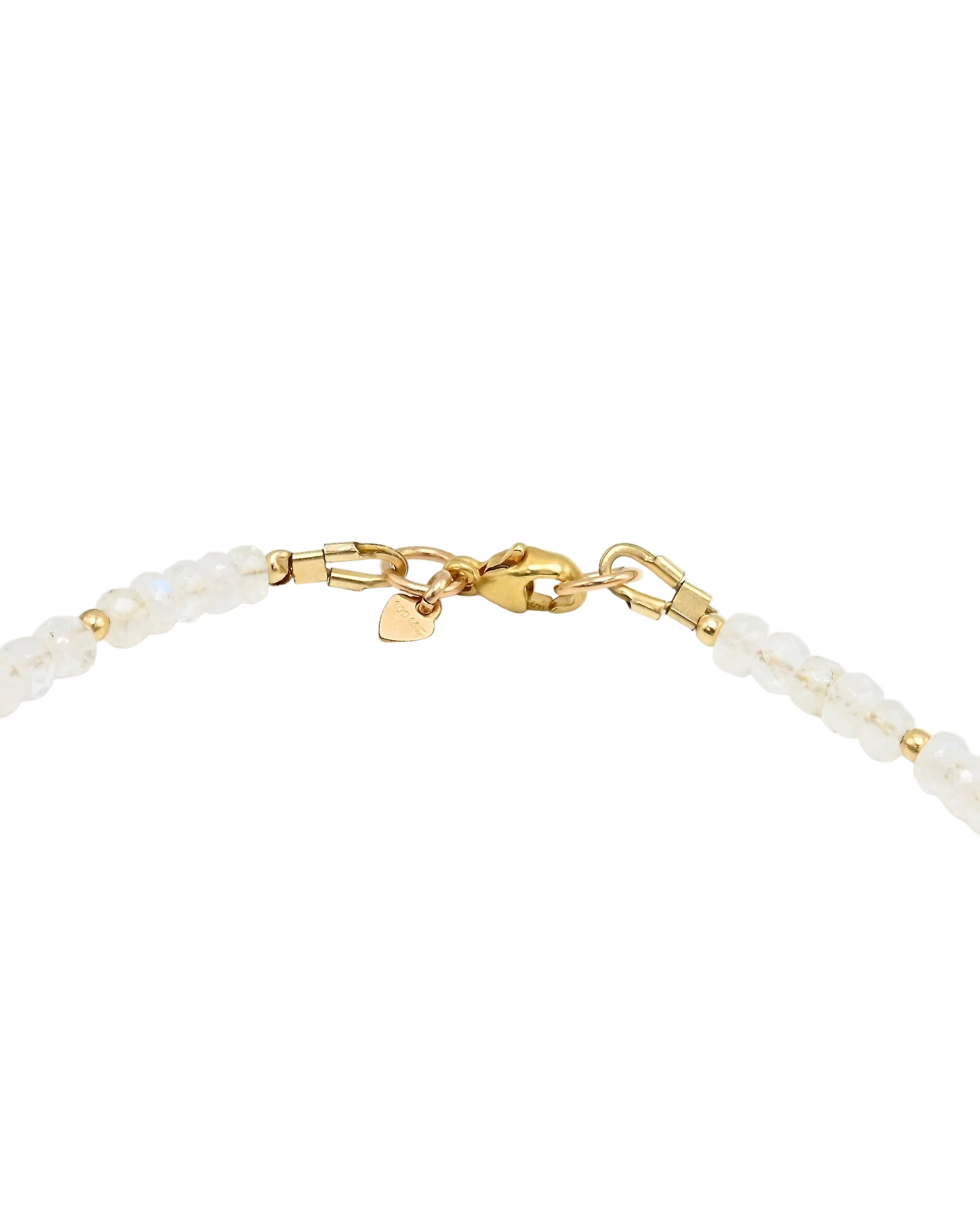 Bracelet with gold chain and heart-shaped charms on a white background