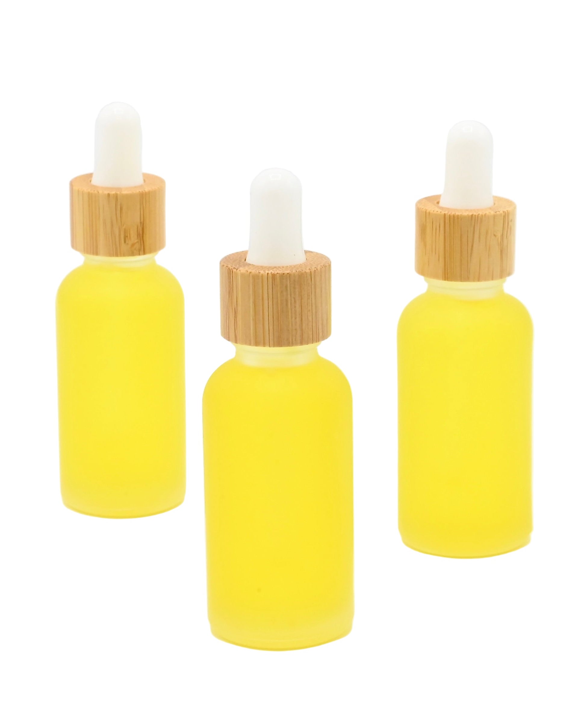 Naked, ritual face oil, hydrating serum ropper bottles with bamboo caps on a white background