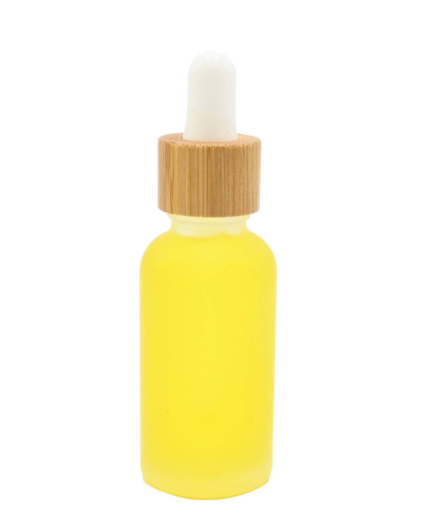 Naked, ritual face oil by sculptress handmade in Big Sur, California Yellow dropper bottle with a bamboo cap on a white background