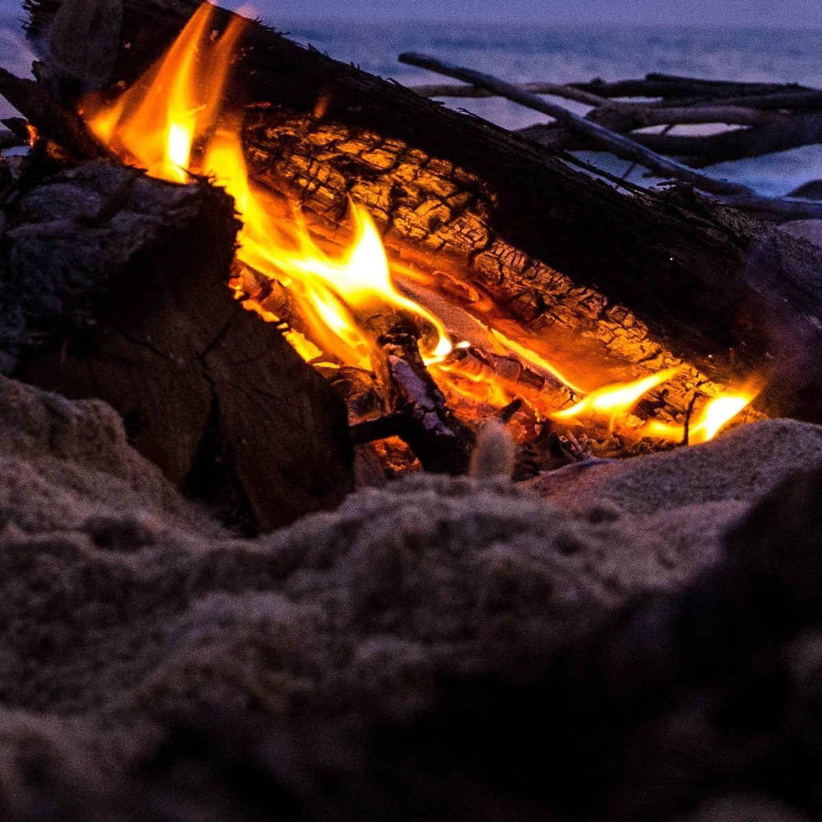 Fire element jewelry — beach bonfire flame at dusk, handmade in Big Sur | Sculptress