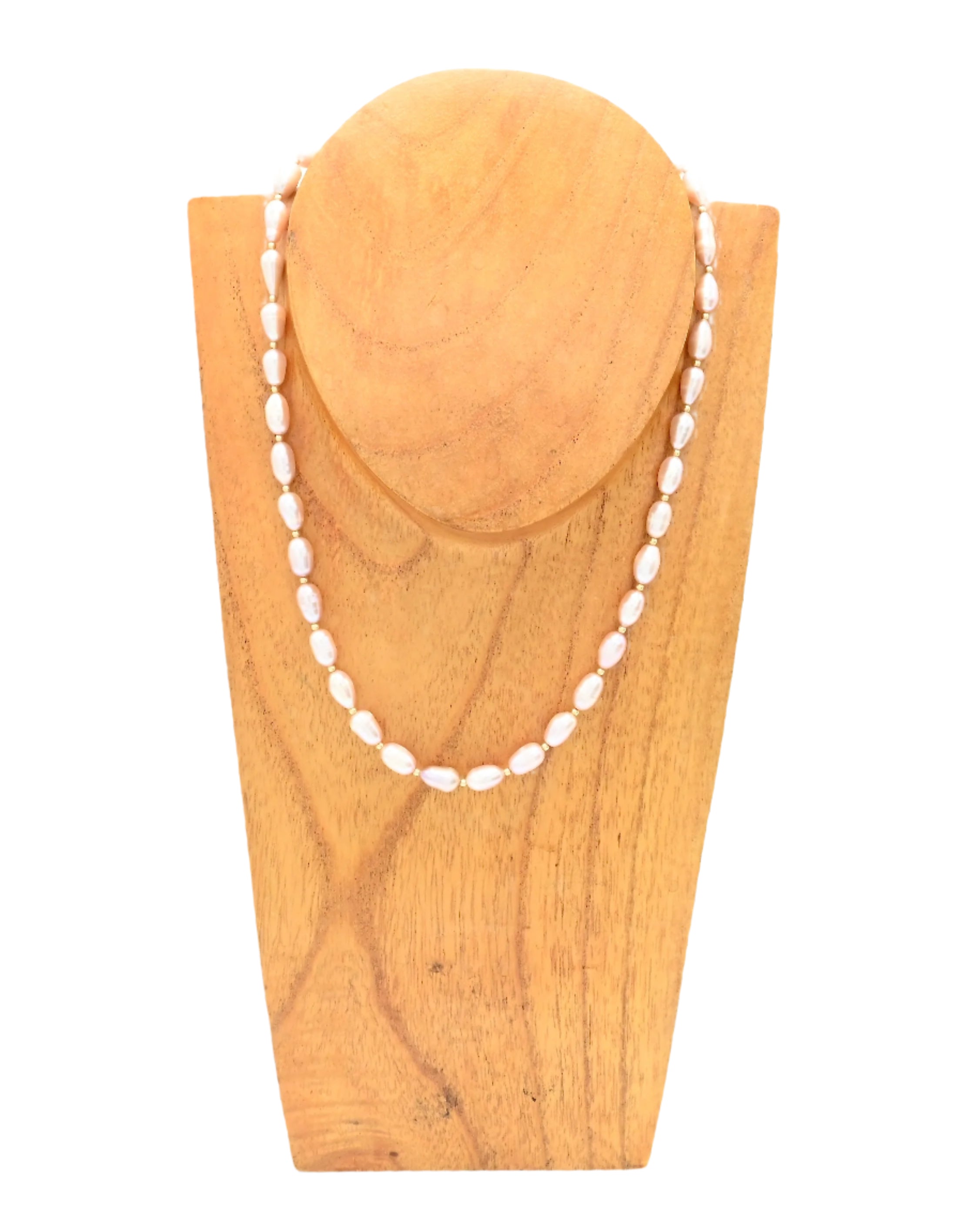 14k gold filled Necklace with pink freshwater pearl beads on a wooden stand against a white background