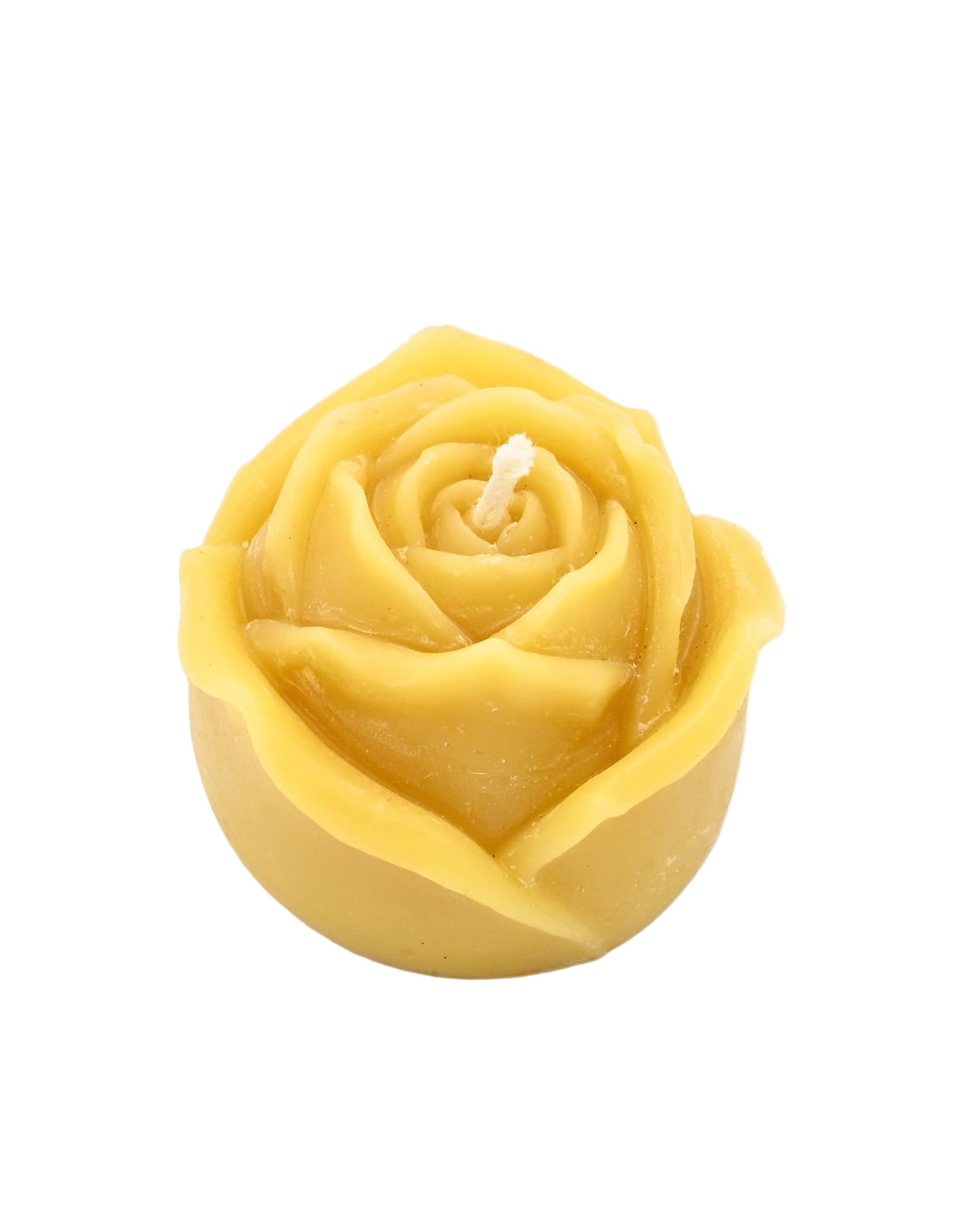 Yellow rose-shaped candle on a white background