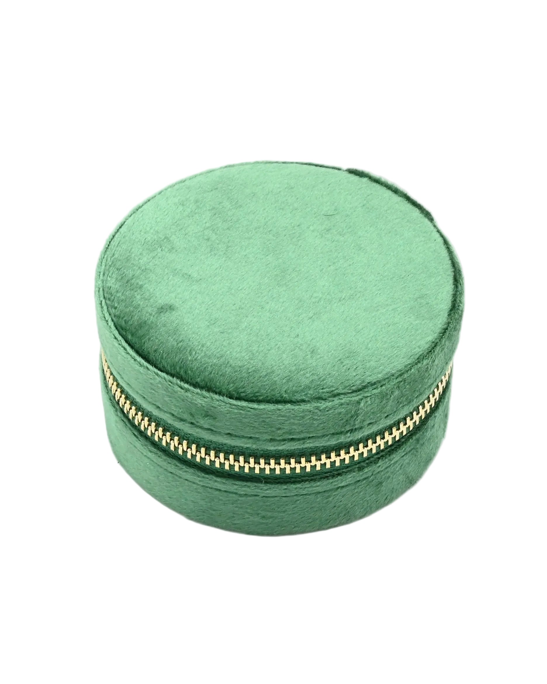 Green velvet jewelry box with a gold zipper on a white background