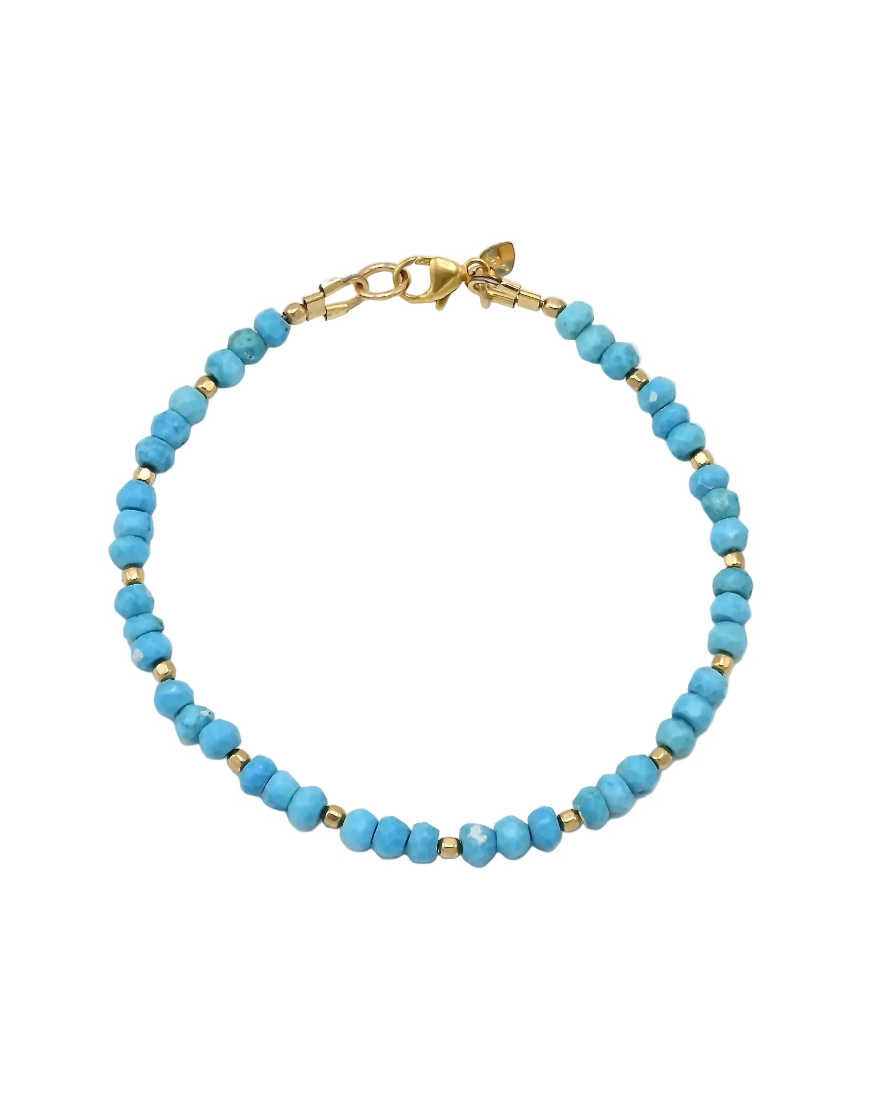 A beaded bracelet with light blue turquoise cylindrical beads separated by small gold spacer beads, featuring a gold lobster clasp and heart-shaped charm, shown on a plain white background.