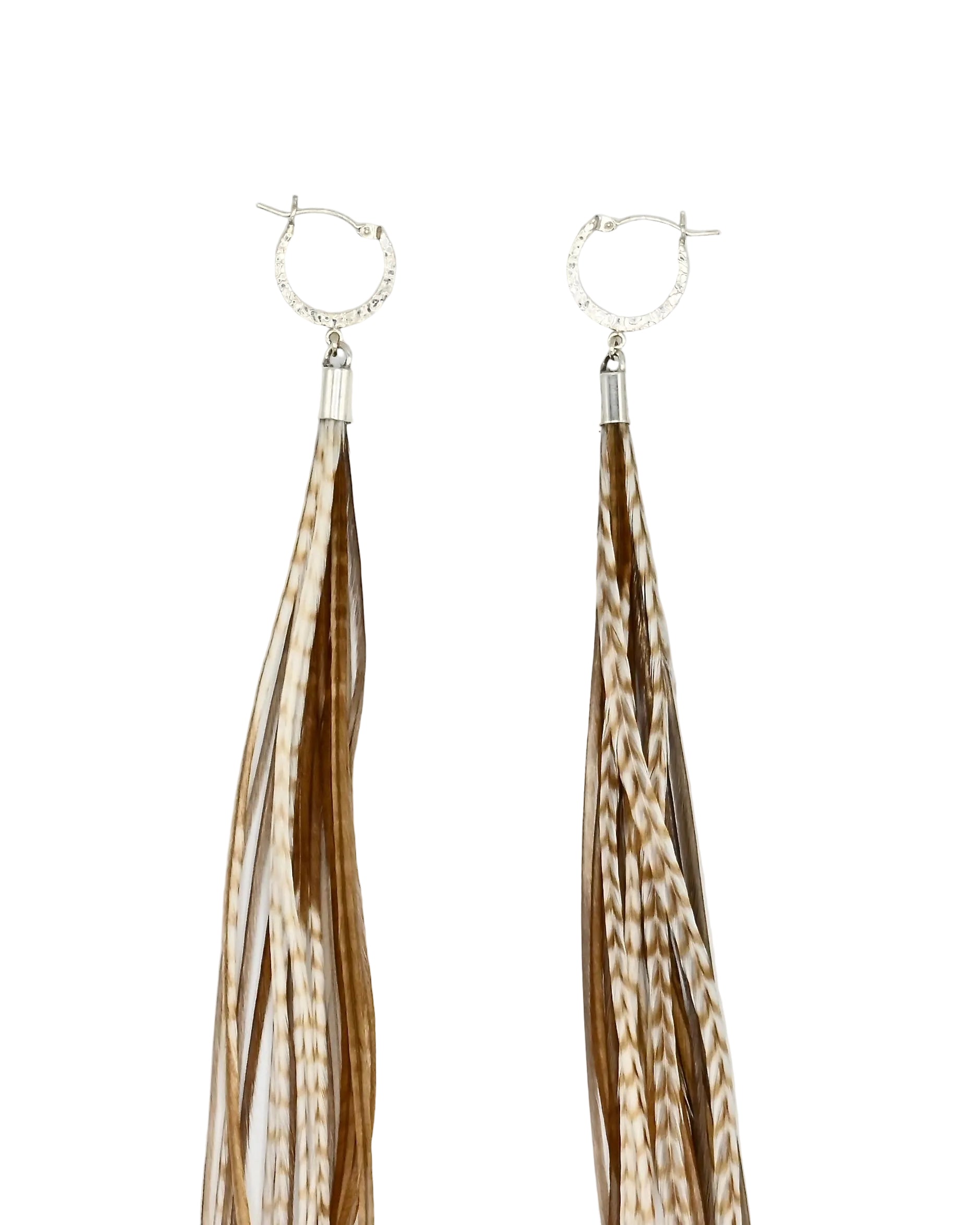 A pair of long dangling earrings with silver hoop tops and multiple thin fringe strands in brown and cream tones, shown on a plain white background.