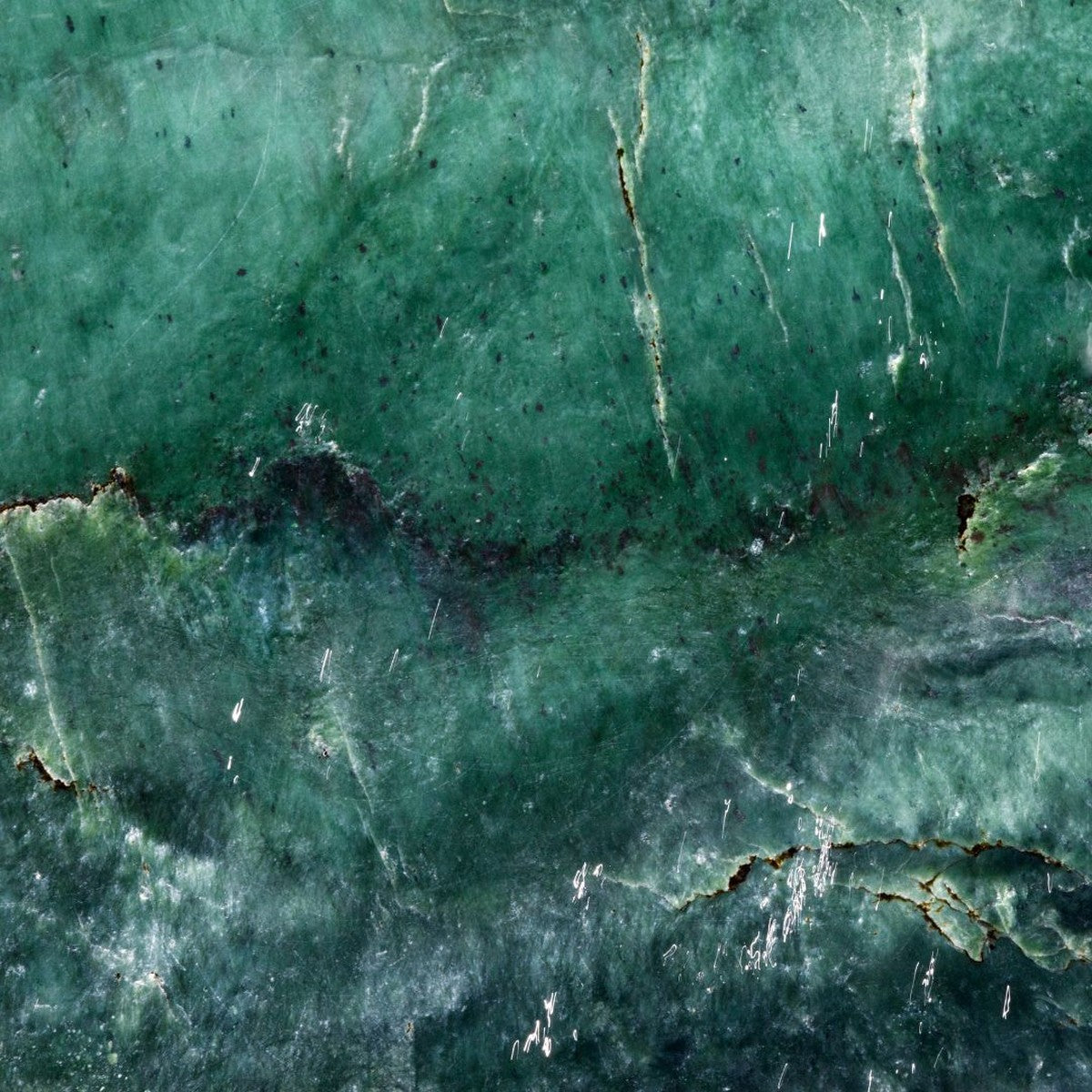 Earth element jewelry — close-up green nephrite jade texture, handmade in Big Sur | Sculptress